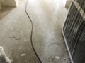 Cable on the dirty floor. Material for repairs in an apartment is under construction remodeling rebuilding and renovation Royalty Free Stock Photo