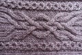 Cable knitting technique on puce knitwork