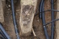 The cable is laid in the ground. Laying the electrical cable in the ground. City communications. Royalty Free Stock Photo