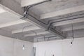 Cable laying ceiling. Electrical wires on wall. Wiring replacement. Connecting light in flat or office. Professional installation