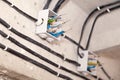 Cable laying ceiling. Electrical wires on wall. Wiring replacement. Connecting light in flat or office. Professional installation