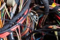 A cable of matted wires of different colors with connectors in the electrical wiring of the car. Internet line in the work of the Royalty Free Stock Photo