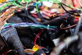 A cable of matted wires of different colors with connectors in the electrical wiring of the car. Internet line in the work of the