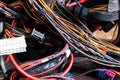 A cable of matted wires of different colors with connectors in the electrical wiring of the car. Internet line in the work of the Royalty Free Stock Photo