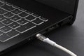 Cable with modern connector USB Type C for charging and syncing your laptop with gadgets. Royalty Free Stock Photo