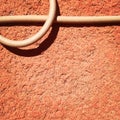 Cable on a peach wall