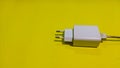 a cable plug head takes center stage against a cheerful yellow background Royalty Free Stock Photo