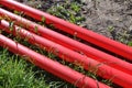 Cable protective pipe lying on the ground Royalty Free Stock Photo