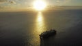 Cable ship sailing near Fiji at sunset Royalty Free Stock Photo