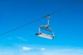 Cable ski chair against blue sky