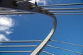 Cable-stayed bridge against the blue cloudy sky close-up