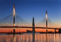 The cable-stayed bridge over Petrovsky fairway and the tower of Lakhta center, at sunset, Saint-Petersburg Royalty Free Stock Photo