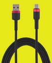 cable with USB and micro USB connector, on a yellow background Royalty Free Stock Photo