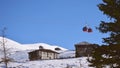 Cable way car in Goderdzi ski resort with old wooden houses in Adjara mountains in winter
