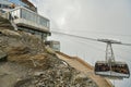 Cablecar overcrowded by tourists approaching top station on top Royalty Free Stock Photo