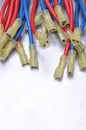 Cables with terminals used in electrical installation systems on grey metal background Royalty Free Stock Photo