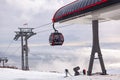Cableway cabin above the clouds at sunset Royalty Free Stock Photo