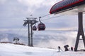 Cableway cabin above the clouds at sunset