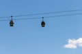 Cableway cabins on the background of the blue sky Royalty Free Stock Photo