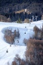 Cableway lift cabins on snowy ski slope background beautiful winter vertical scenery