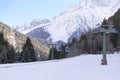 Cableway lift cable cars, gondola cabins on winter snowy mountains background beautiful scenery. Royalty Free Stock Photo