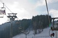 Cableway lift gondola cabins on winter snowy mountains background beautiful scenery Royalty Free Stock Photo