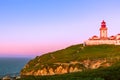 Cabo da Roca, Sintra, Portugal. Lighthouse and cliffs over Atlantic Ocean, the most westerly point of the European mainland at Royalty Free Stock Photo