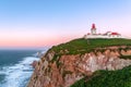 Cabo da Roca, Sintra, Portugal. Lighthouse and cliffs over Atlantic Ocean, the most westerly point of the European mainland at Royalty Free Stock Photo