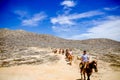 Tourists horseback riding on the beach in Cabo San Lucas, Baja California