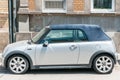 Cabriolet Mini Cooper S car with convertible roof parked on the street in the city. Royalty Free Stock Photo