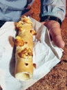 Cabure, typical Argentinean street food, made with flour and cheese and roasted on a spit