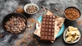 Cacao beans, powder, cacao butter  and chocolate bar Royalty Free Stock Photo