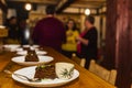 Cacao cake and a cup of tea on a bar table Royalty Free Stock Photo