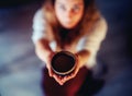 Cacao ceremony, heart opening medicine. Ceremony space. Cacao cup in woman& x27;s hand. Royalty Free Stock Photo