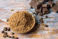 Cacao powder in a bowl with chocolate and cinnamon Royalty Free Stock Photo
