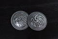 Metal medals inspired by the Stark house shields and Targaryen from the TV series Game of Thrones for sale as amulets.