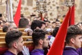 Caceres, Spain. April 2019: A group of bearers, called Costaleros, carrying a religious float