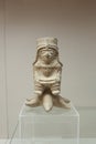 Jama Coaque figurine depicting a lord seated over sea star