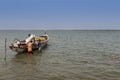 Fishermen preparing their canoe in the port of the city of Cacheu