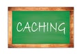 CACHING text written on green school board