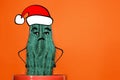 Cactus hipster man with santa hat. Tropical Christmas concept. Minimal fun art Royalty Free Stock Photo