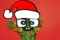 Cactus hipster man with santa hat. Tropical Christmas concept. Minimal fun art Royalty Free Stock Photo