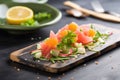 cactus salad with grapefruit segments on a slate board for a citrus twist