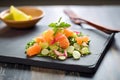 cactus salad with grapefruit segments on a slate board for a citrus twist