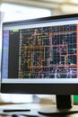 CAD software showing an electrical grid map overlay on a geographic layout displayed on a workstation. Royalty Free Stock Photo