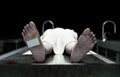 Cadaver, dead male body in morgue on steel table. Corpse. Autopsy concept. 3d rendering.