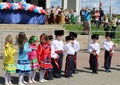 Cadets and girls execute the Cossack dance