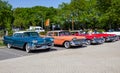 1958 Cadillac Coupe De Ville and Plymouth Sport Fury classic cars on the parking lot. Rosmalen, The Netherlands - May 8, 2016