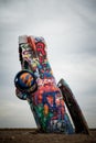 A car from the Cadillac Ranch, along Historic Route 66 in Amarillo, Texas. Grungy, colorful.