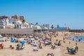 Cadiz SPAIN - 8 August 2022 - Bathers at La Caleta beach with structure on the sand of Our Lady de la Palma y del Real spa